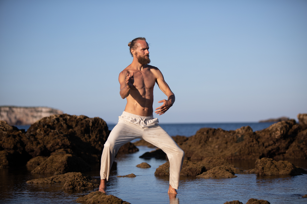 Breathwork wide stance standing pose in water